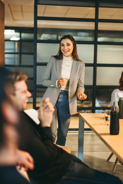 Female leader collaborating on a tech project in an office boardroom