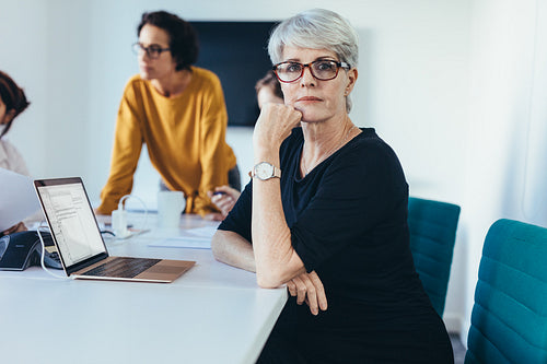 Mature woman in a business meeting