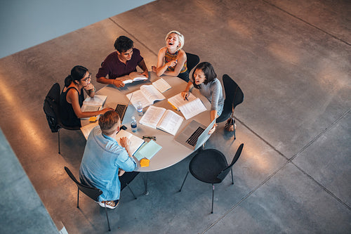 Group of students sitting together at table
