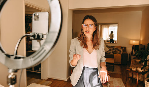 Millennial mom recording content for her social media channel