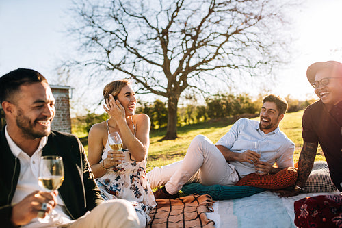 Multiracial group of friends enjoying party at restaurant