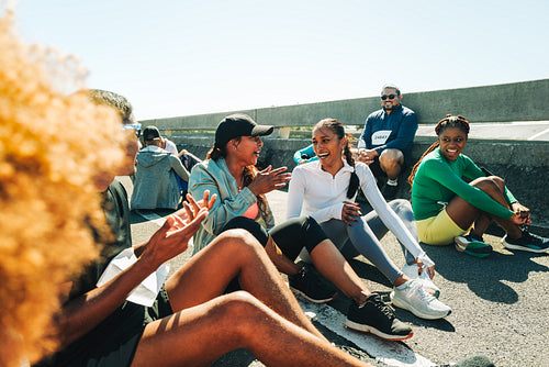Group of friends relaxing after a marathon race together