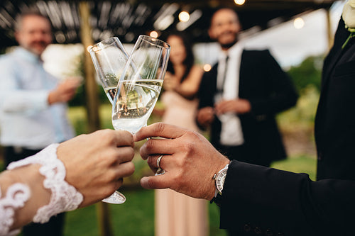 Bride and groom with glasses of champagne