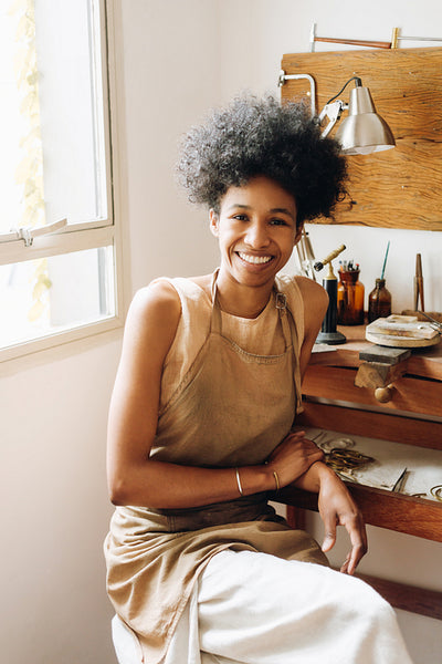 Jewelry designer smiling at camera