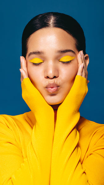 Makeup confidence: Woman embraces face with eyeshadow