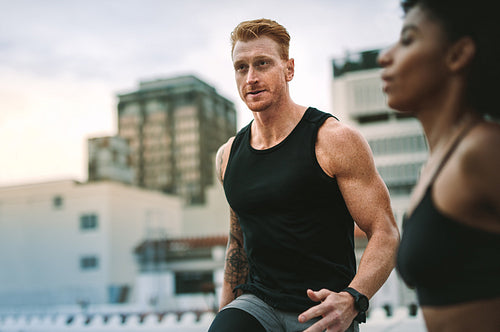 Fitness couple training on rooftop