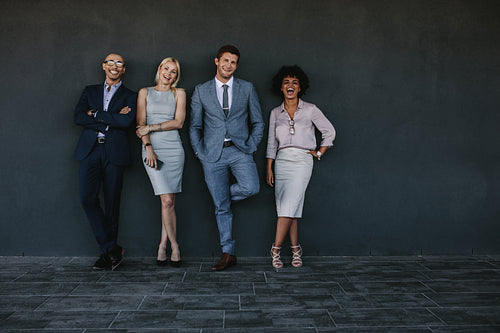 Multi-ethnic group of laughing business people