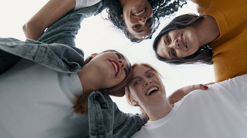 Friends in a huddle and moving in a circle