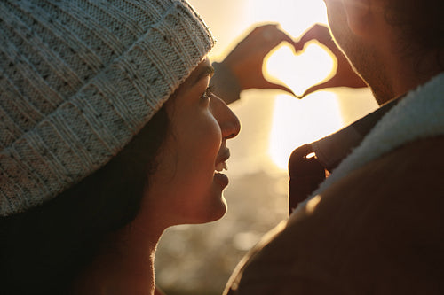 Couple in love gesturing a heart