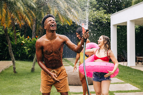 Friends enjoy outdoor pool party fun