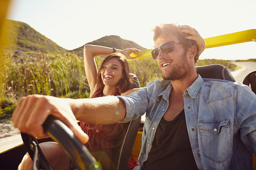 Cheerful young couple on road trip