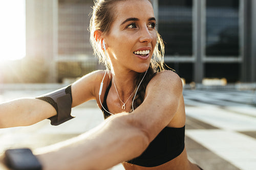 Female athlete warming up before workout