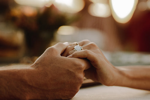 Romantic couple holding hands