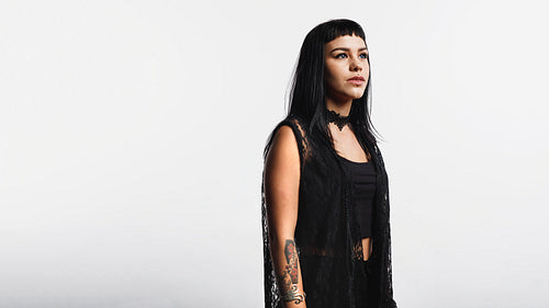 Gothic woman with tattoo and piercings