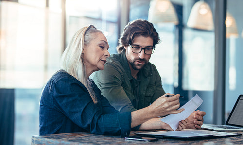 Business colleagues discussing work in office