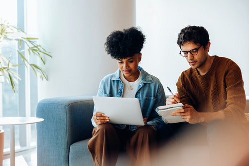 Focused review: Colleagues work through project details together