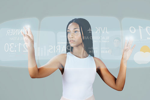 Woman looking at the weather and available flights on a virtual flight centre