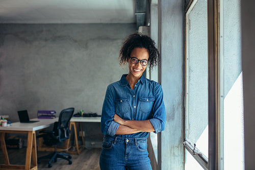 Confident entrepreneur in her office