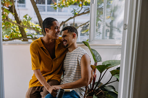 Laughing couple enjoying time together at home