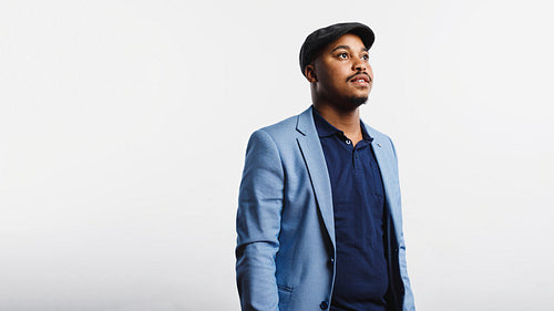 Portrait of man in coat and cap