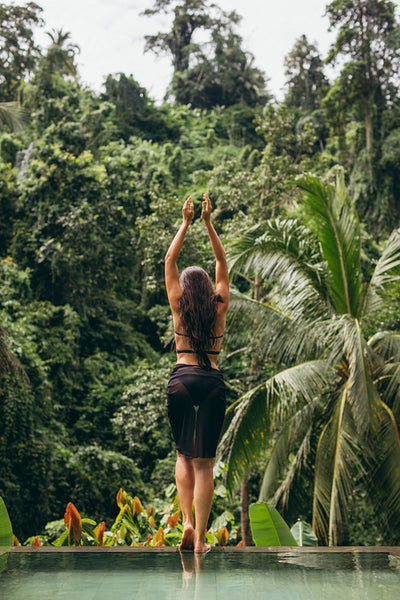 Woman in black bikini near pool