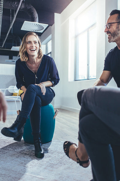 Woman smiling during team discussion