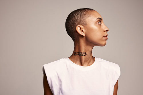 Androgynous woman looking away