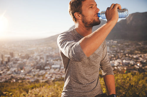 Young man taking a break after morning run