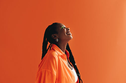 Woman with makeup smiling in a studio