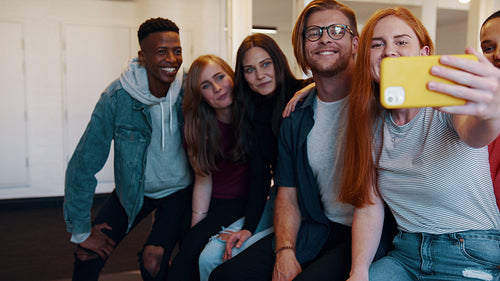 Friends taking selfie in university campus