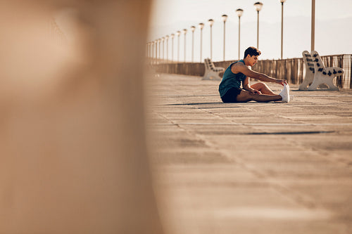 Healthy young man taking a break running session