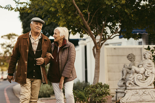 Senior couple enjoy a walk together on a winter day