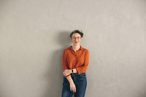 Mature businesswoman with eyeglasses smiling at the camera