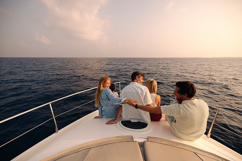 Surreal sunset luxury: Family enjoying yacht ride