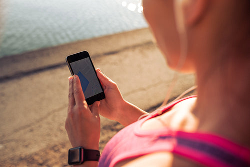 Sports woman using smart phone