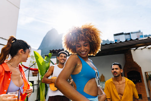 Group of friends enjoying a roda de samba in Rio de Janeiro outdoors