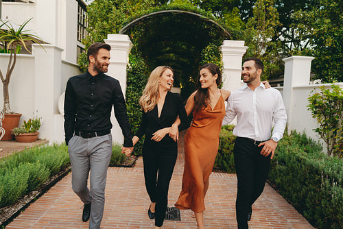 Two happy couples arriving at a couples retreat