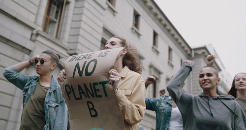 Protestors demonstrating on street against climate change