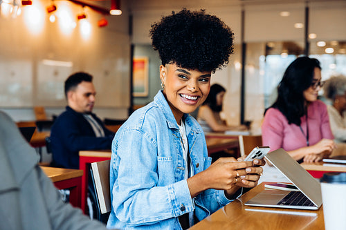 Bright start: A young professional settles into her workday