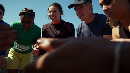 Runners celebrating their success together