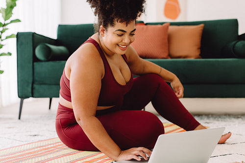 Health woman exercising watching online training videos