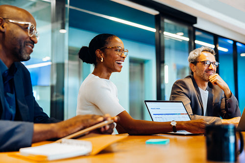 Group of professionals discussing documents during an office meeting
