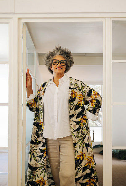 Mature businesswoman smiling at the camera in an office