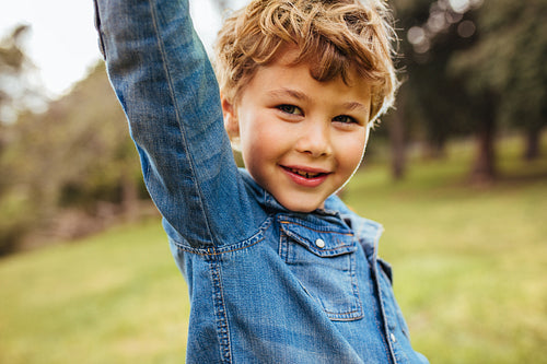 Cute little boy standing at the park