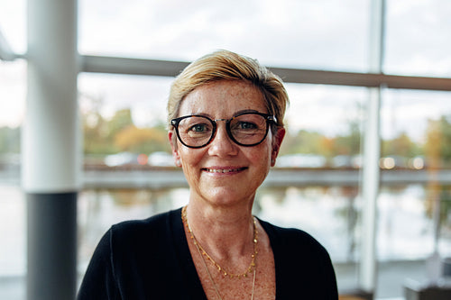 Portrait of confident mature businesswoman in office