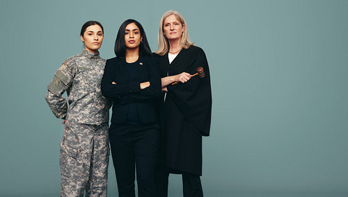 Group of women from different government occupations standing in