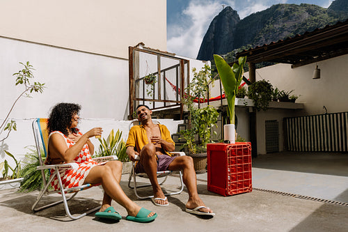Friends enjoy a sunny day in Rio de Janeiro with laughter and relaxation