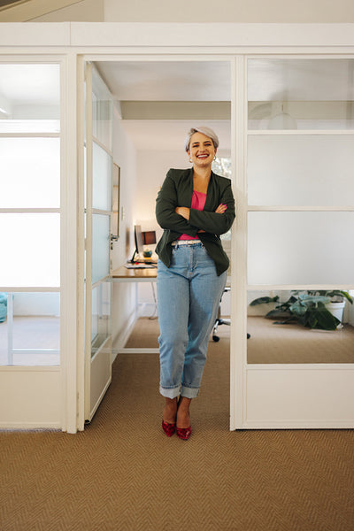 Successful businesswoman standing with her arms crossed