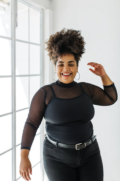 Attractive woman in fashionable outfit