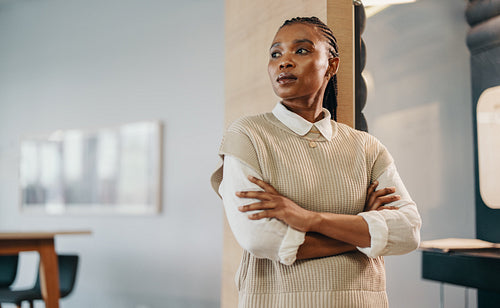 Young businesswoman contemplating success in an office